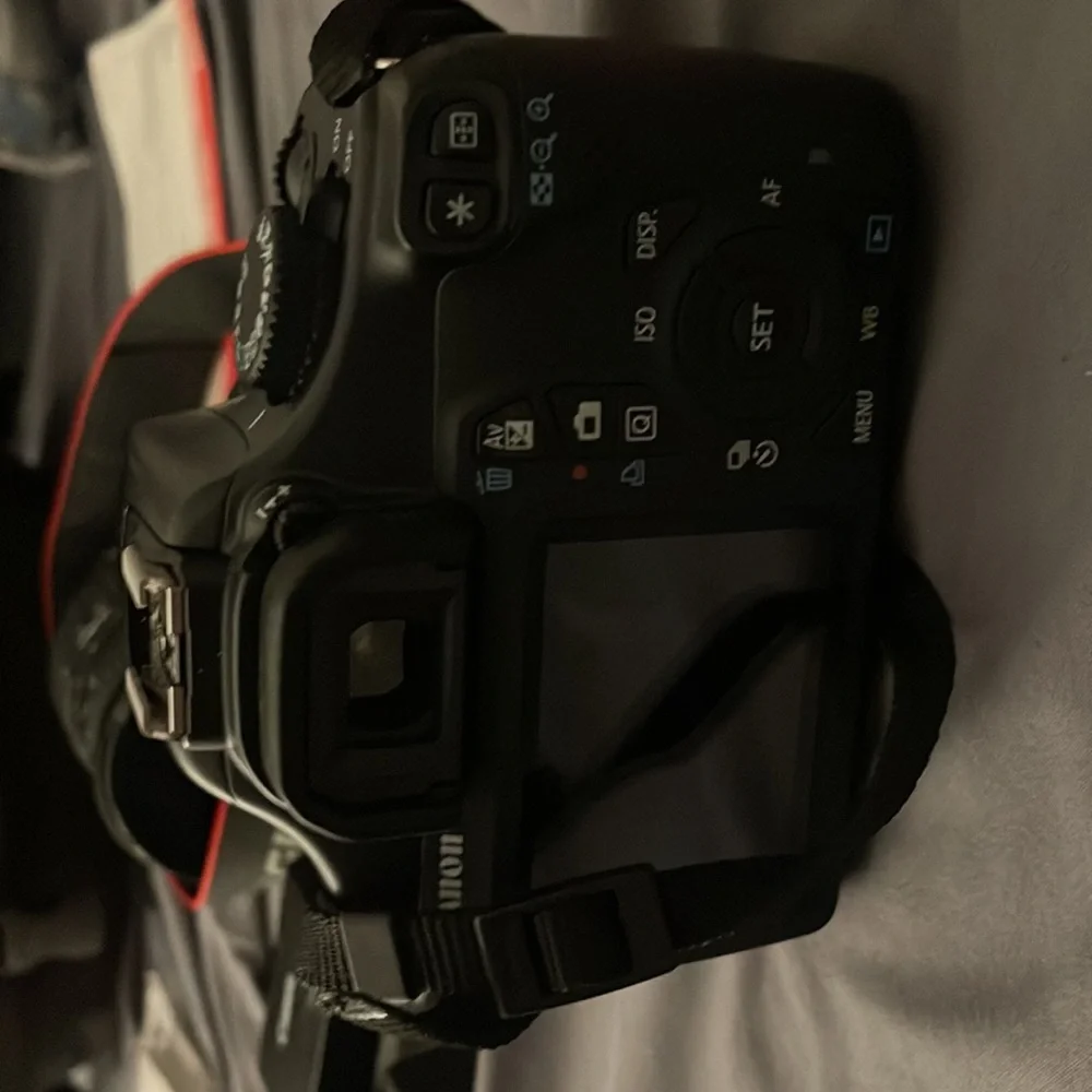 TOTAL CAMERA PACKAGE INCLUDES CANON T3 REBEL CAMERA, TELEPHOTO LENSE AND BAG